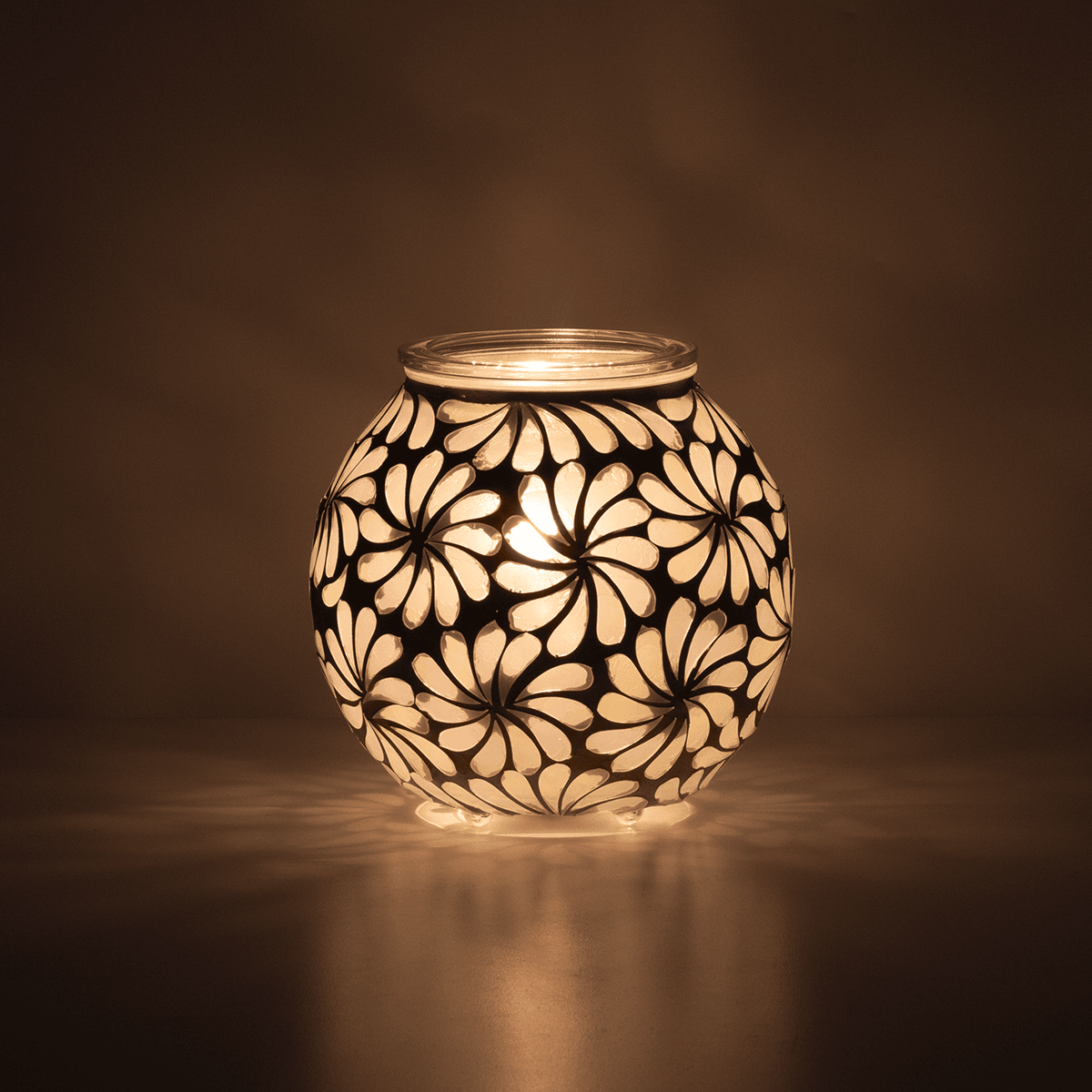 Decorative lamp with floral pattern on a dark background