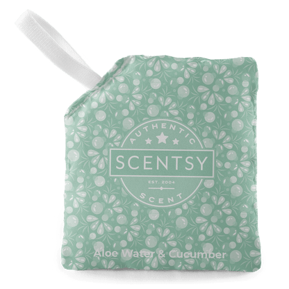 Scentsy product packaging with floral pattern on a black background