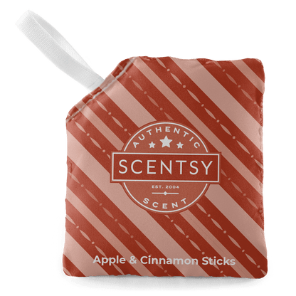 Scentsy Apple & Cinnamon Sticks packaging with red and white striped design on a black background