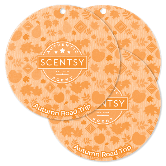 Two Scentsy Autumn Road Trip scented wax discs on a black background
