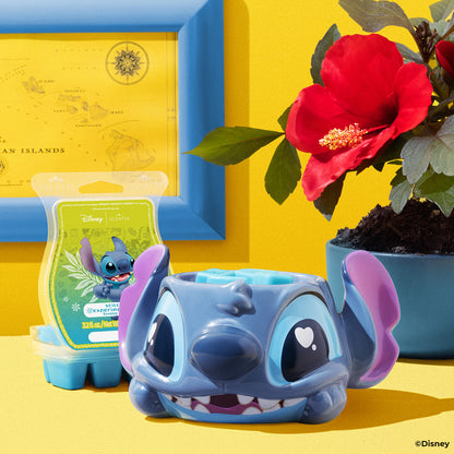 Blue cartoon character figurine with a yellow box and red flower in the background