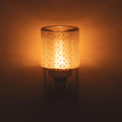Decorative night light with textured glass罩and warm glow on a dark background