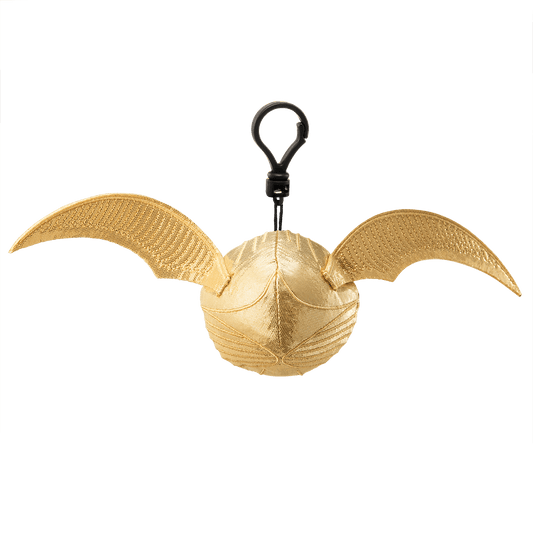 Gold Snitch keychain with wings on a black background