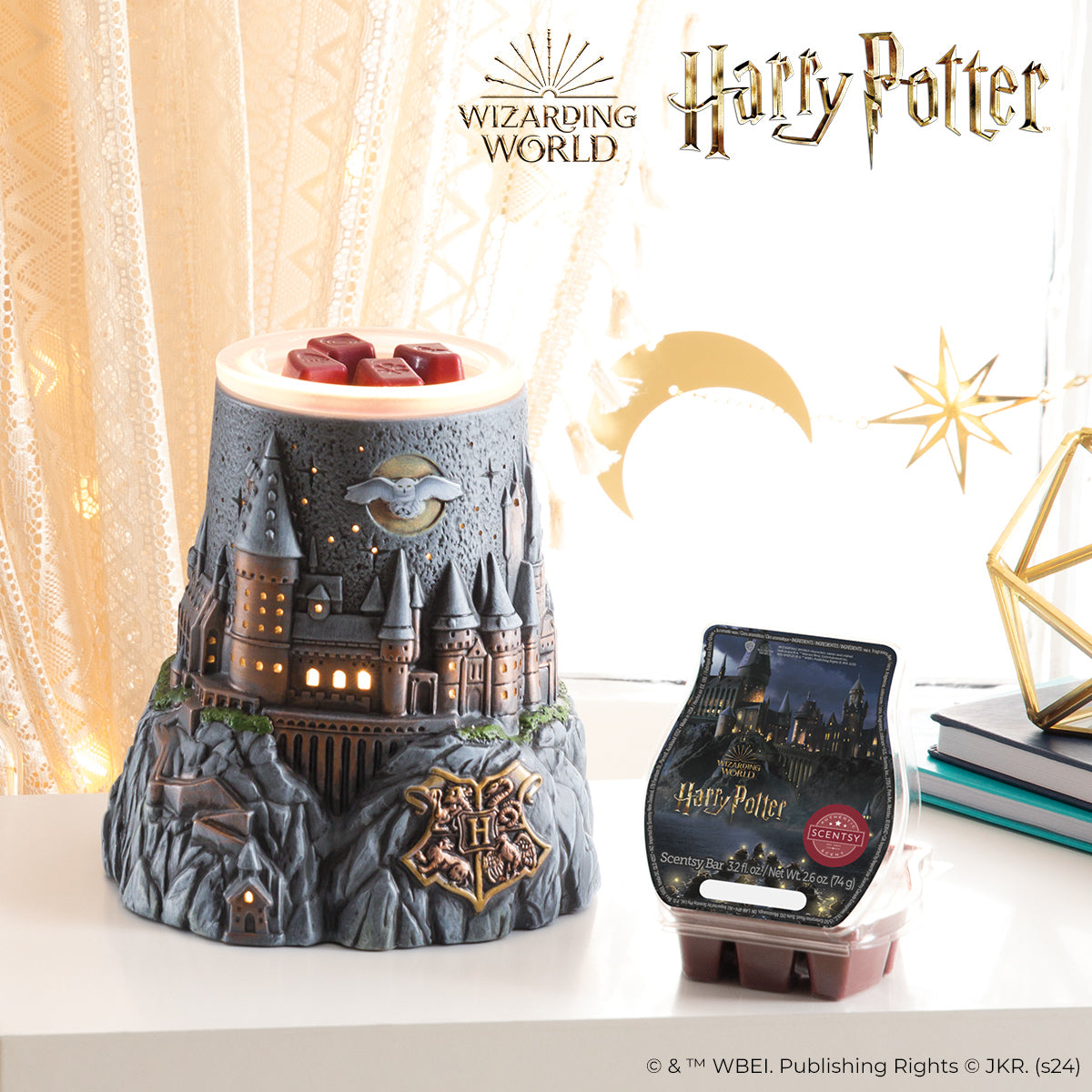 Harry Potter-themed wax warmer with Hogwarts castle design on a white surface.