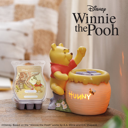 Winnie the Pooh-themed product set with a honey pot and wax melts on a wooden surface.