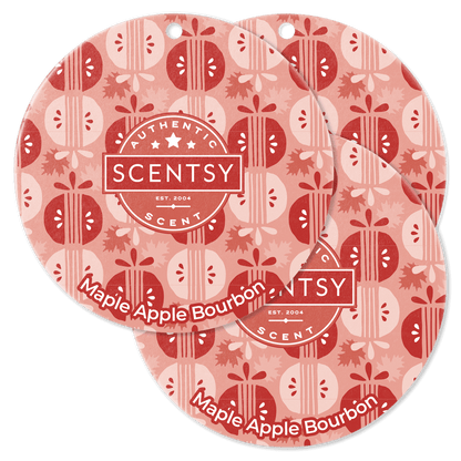 Two Scentsy Maple Apple Bourbon scented wax melts with a red and white pattern on a black background.
