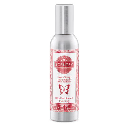 Scentsy room spray bottle with pink label on a green background