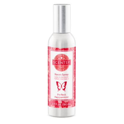 Scentsy room spray bottle with red label on a white background