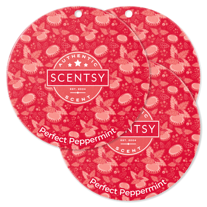 Two Scentsy Perfect Peppermint scented wax discs on a red background with floral pattern.