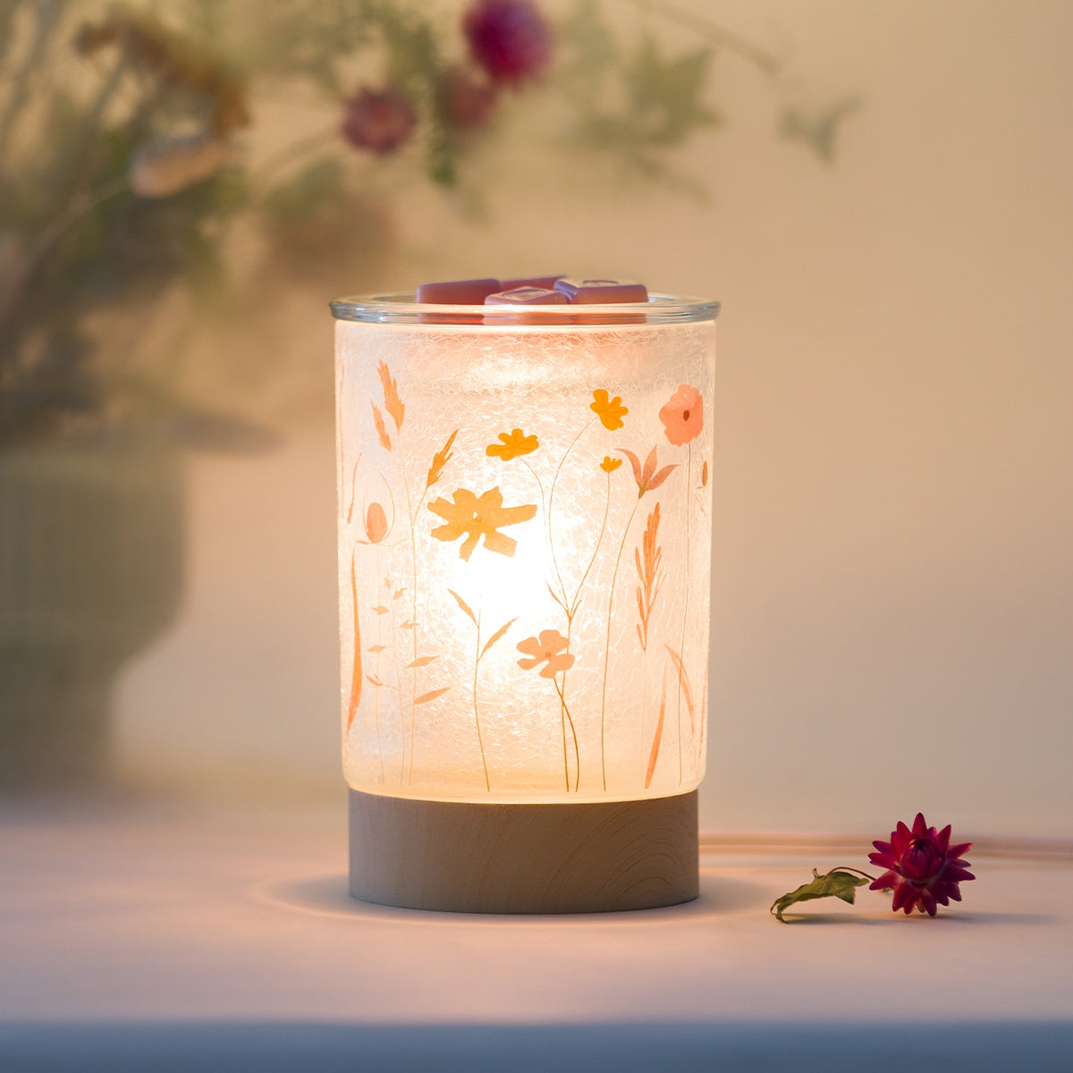 Decorative lamp with floral design on a blurred background