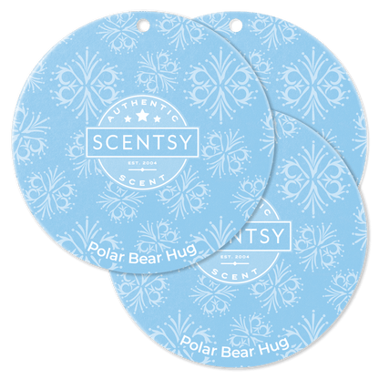 Two Scentsy Polar Bear Hug scented wax discs on a black background