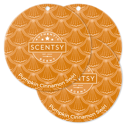 Two Scentsy Pumpkin Cinnamon Swirl scented circles on a black background