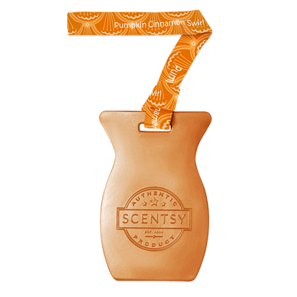 Scentsy product with a pumpkin cinnamon swirl ribbon on a black background
