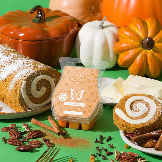 Scentsy wax melt with pumpkins, cookies, and spices on a green background