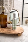 Bathroom setting with bottles on a wooden surface