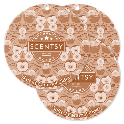 Two Scentsy Salted Caramel Cider scented wax melts on a green background