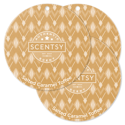 Two Scentsy Salted Caramel Toffee scented wax discs on a black background