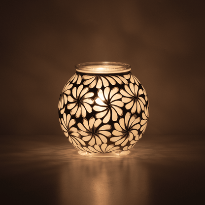Decorative lamp with floral pattern on a dark background
