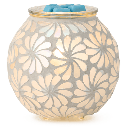 Decorative wax warmer with floral pattern on a white background