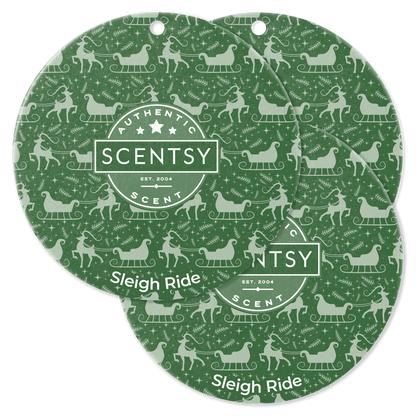 Two green Scentsy Scent Circle packaging with 'Sleigh Ride' design on a black background