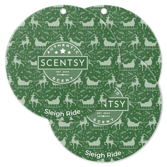 Two green Scentsy Scent Circle packaging with 'Sleigh Ride' design on a black background
