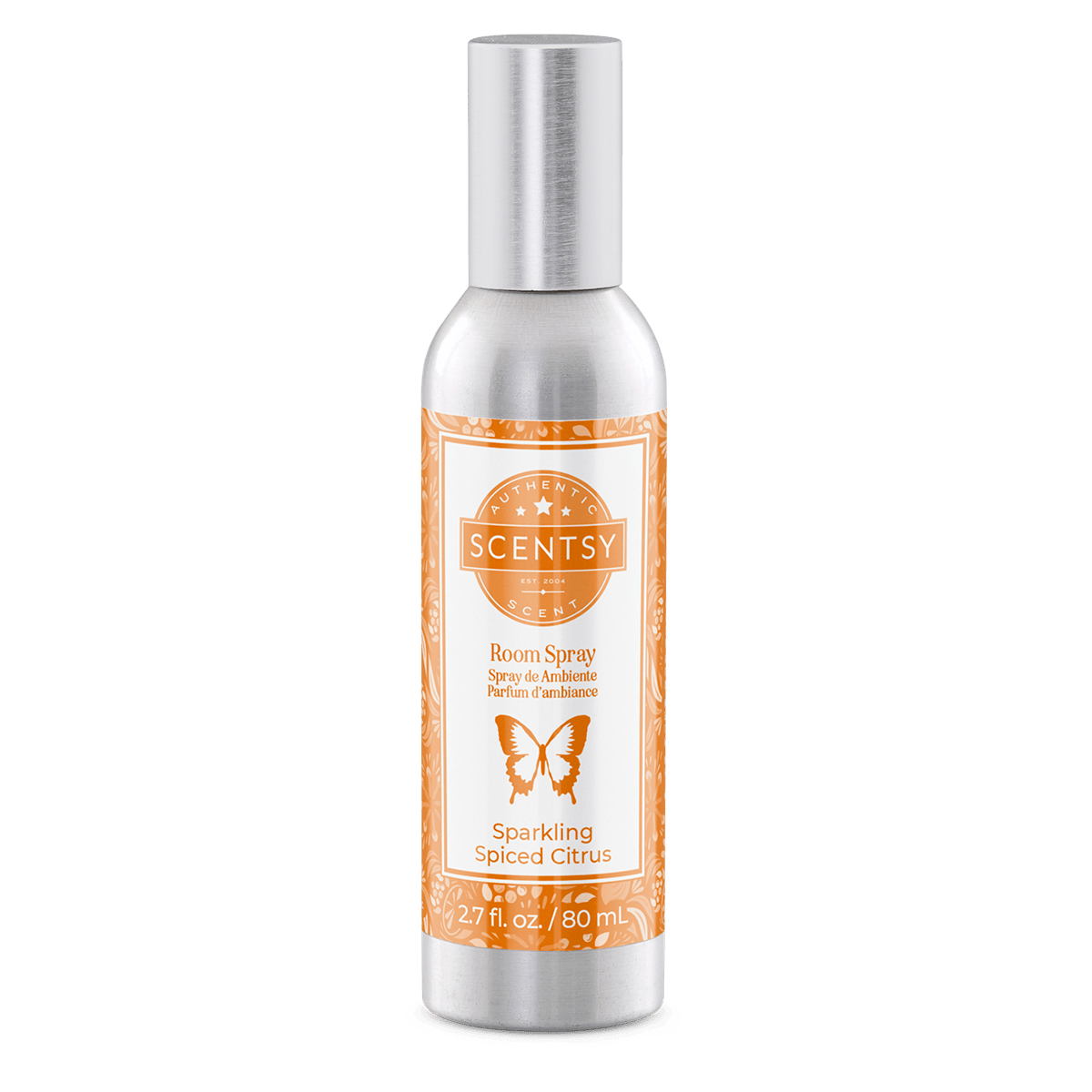 Scentsy room spray bottle with orange label on a green background