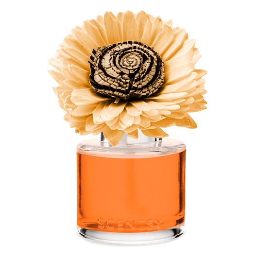 Orange perfume bottle with a decorative flower on a black background