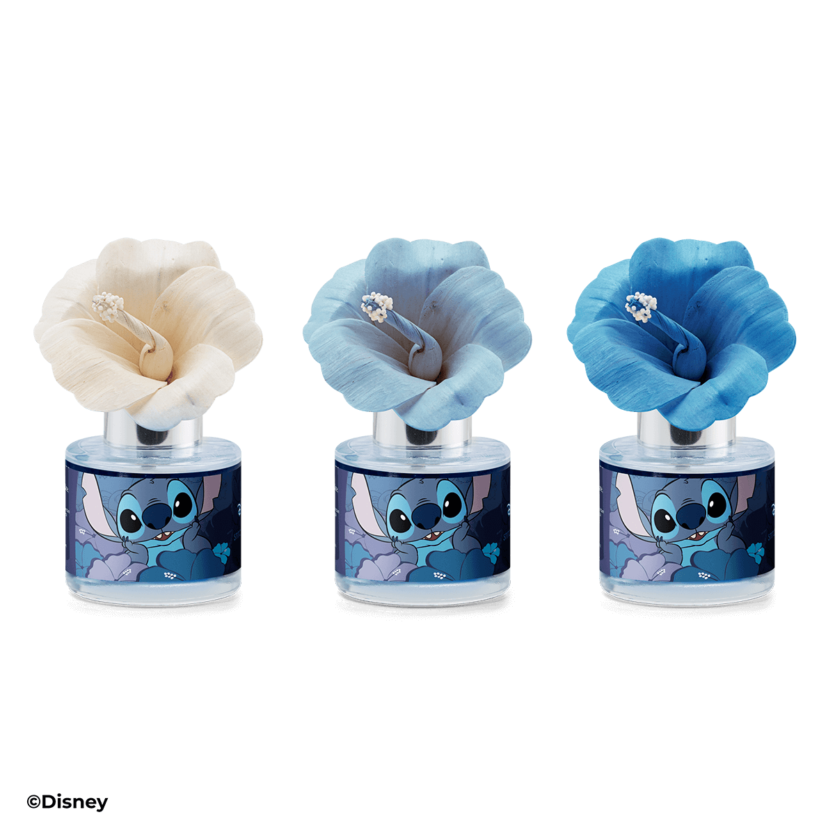 Three cartoon character-themed air fresheners with different colored flowers on a black background.