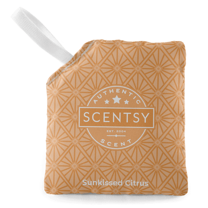 Scentsy Sunkissed Citrus scented wax bar with a white handle on a black background
