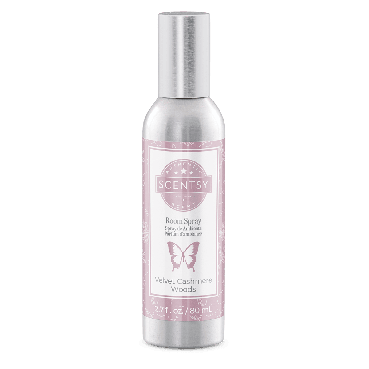 Scentsy room spray bottle with pink label on a green background