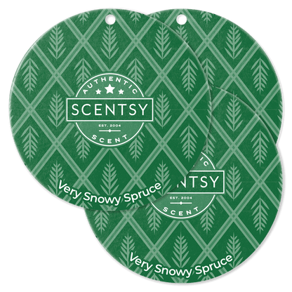 Two Scentsy Very Snowy Spruce scented throw pillows with green and white pattern on a black background.