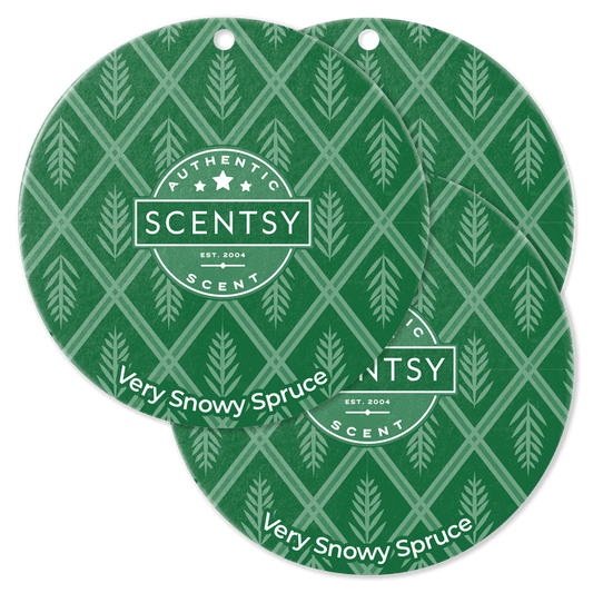 Two Scentsy Very Snowy Spruce scented throw pillows with green and white pattern on a black background.