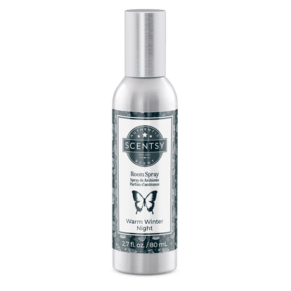 Scentsy room spray bottle labeled 'Warm Winter Night' on a green background