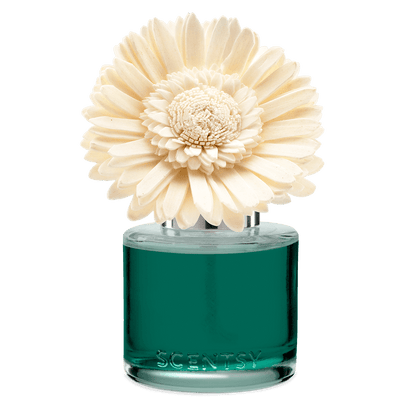 Scentsy diffuser with a large white flower on top against a black background