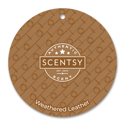 Scentsy Weathered Leather scent disc with brand logo on a brown background