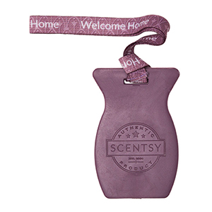 Purple Scentsy warmer with a pink 'Welcome Home' tag on a white background