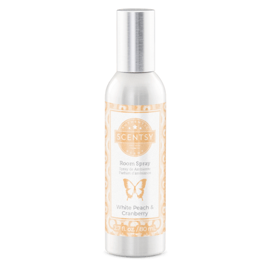 Scentsy room spray bottle with white peach and cranberry scent on a white background