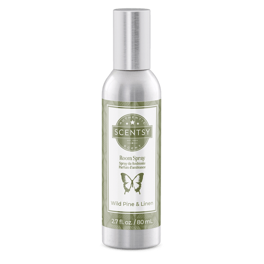 Scentsy room spray bottle with label on a green background