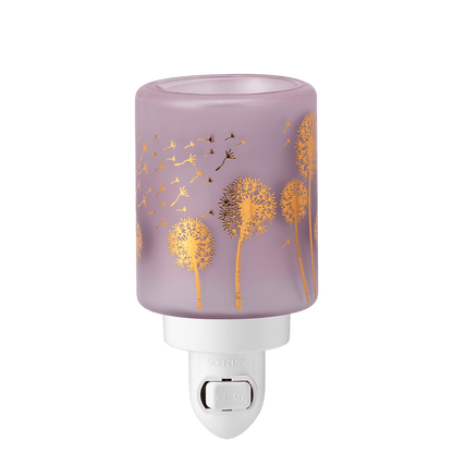 Decorative night light with dandelion design on a purple background