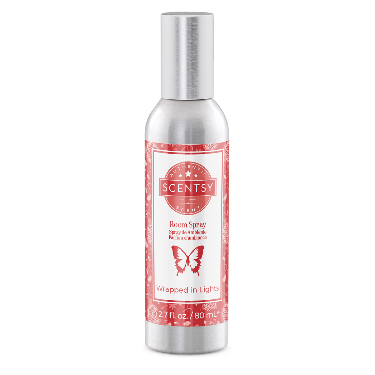 Scentsy room spray bottle with red label on a green background