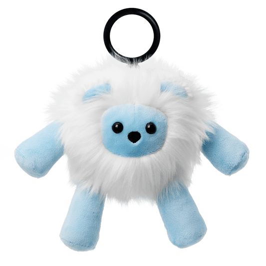 Plush toy resembling a fluffy creature with blue accents on a black background