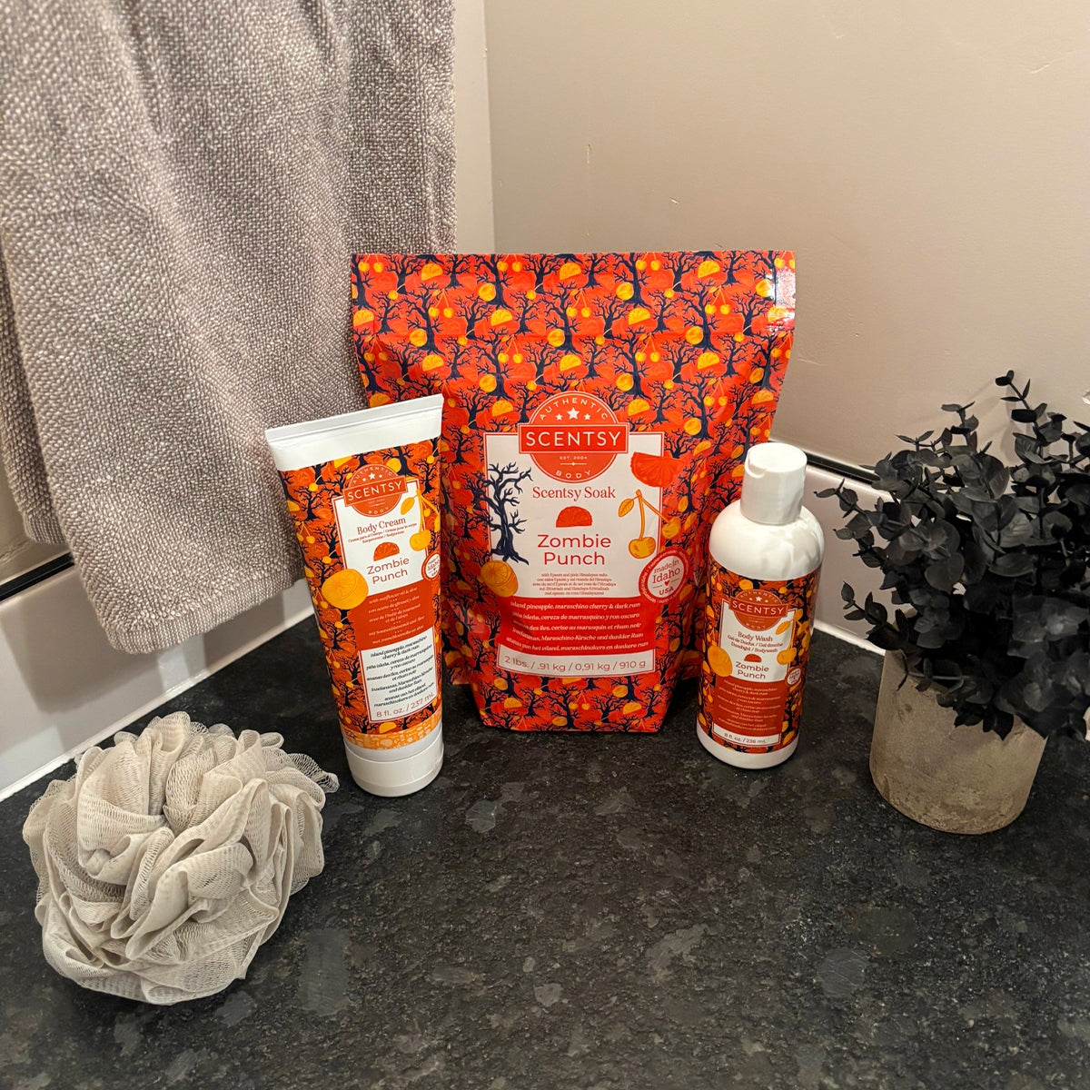 Scentsy Zombie Punch products including a bar of soap, lotion, and packaging on a dark surface.