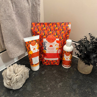 Scentsy Zombie Punch products including a bar of soap, lotion, and packaging on a dark surface.